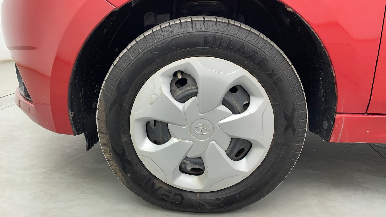 Used 2017 Tata Tiago Revotron XT Petrol Manual tyres LEFT FRONT TYRE RIM VIEW