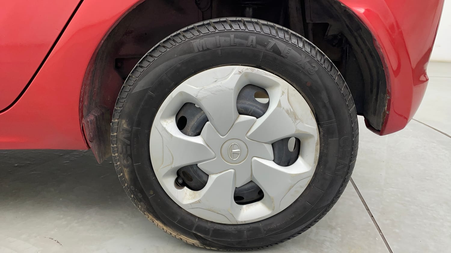Used 2017 Tata Tiago Revotron XT Petrol Manual tyres LEFT REAR TYRE RIM VIEW