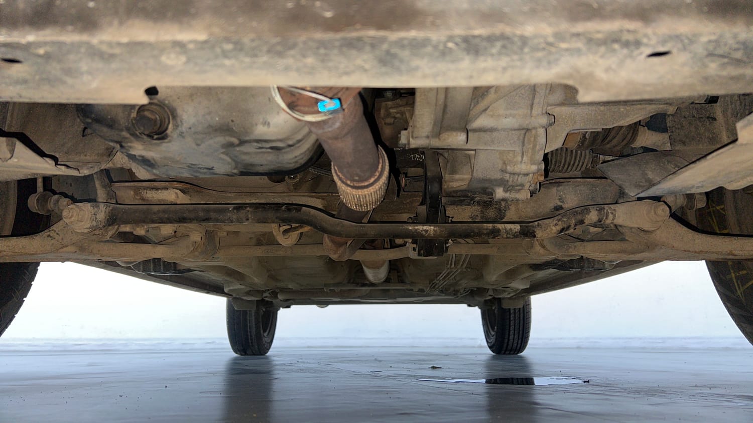 Used 2016 Tata Tiago Revotron XT Petrol Manual extra FRONT LEFT UNDERBODY VIEW