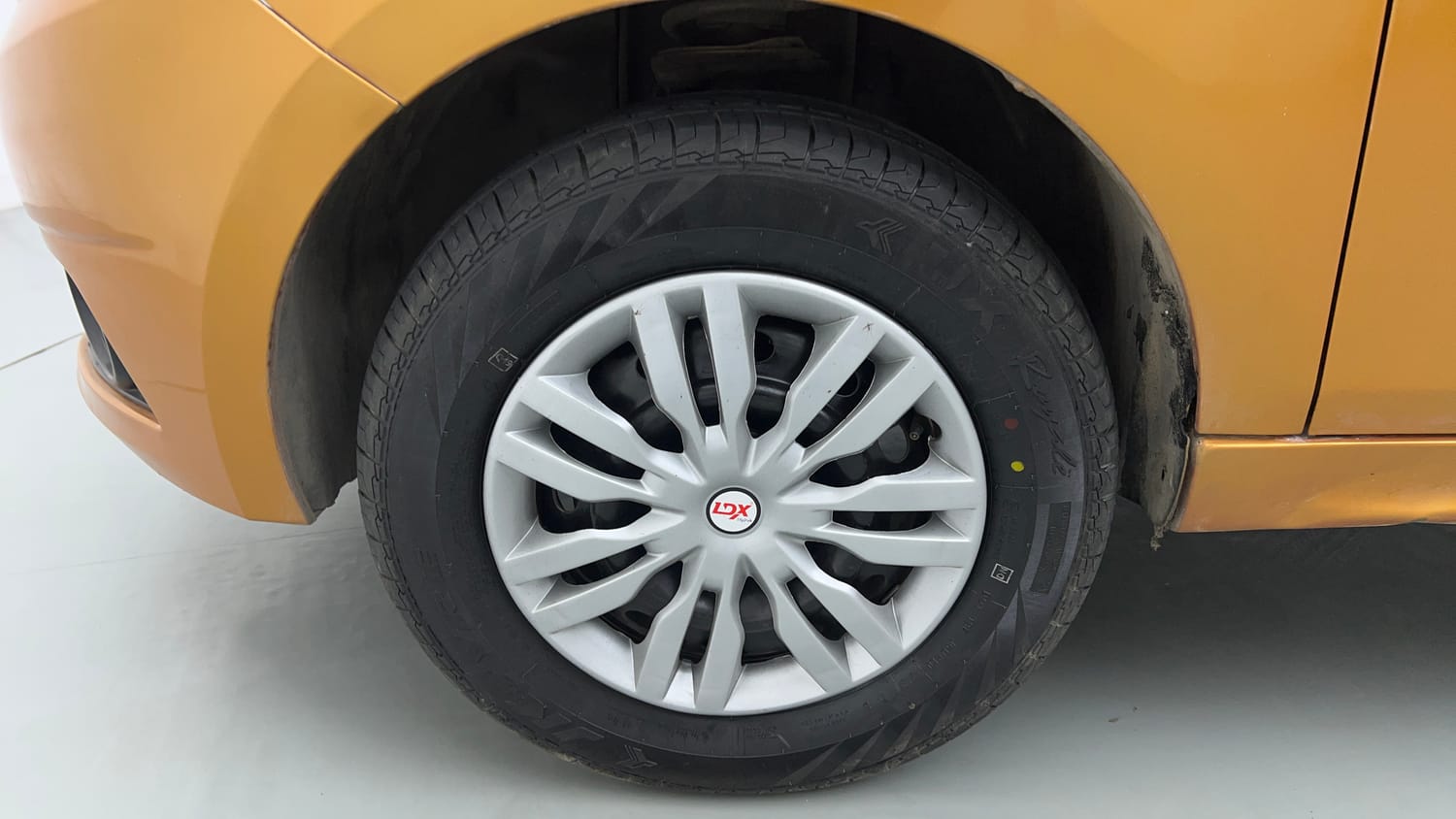 Used 2016 Tata Tiago Revotron XT Petrol Manual tyres LEFT FRONT TYRE RIM VIEW