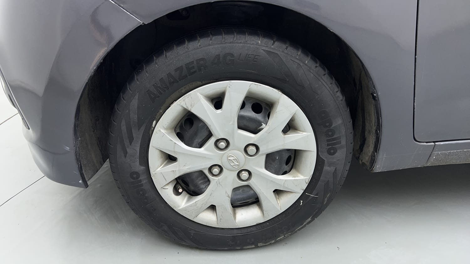 Used 2014 Hyundai Grand i10 Magna 1.2 Kappa VTVT Petrol Manual tyres LEFT FRONT TYRE RIM VIEW