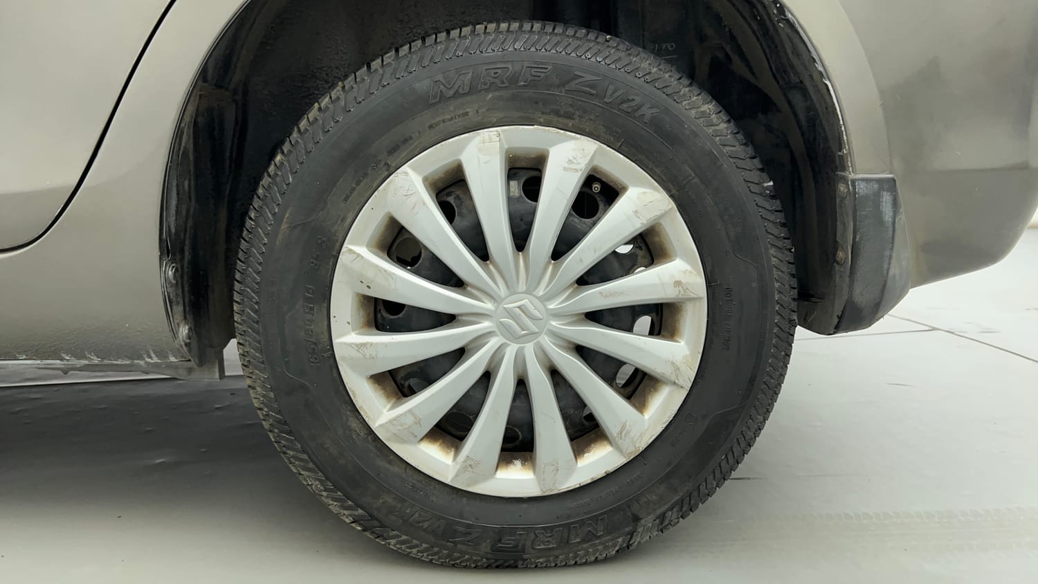 Used 2015 Maruti Suzuki Swift Dzire VXI Petrol Manual tyres LEFT REAR TYRE RIM VIEW
