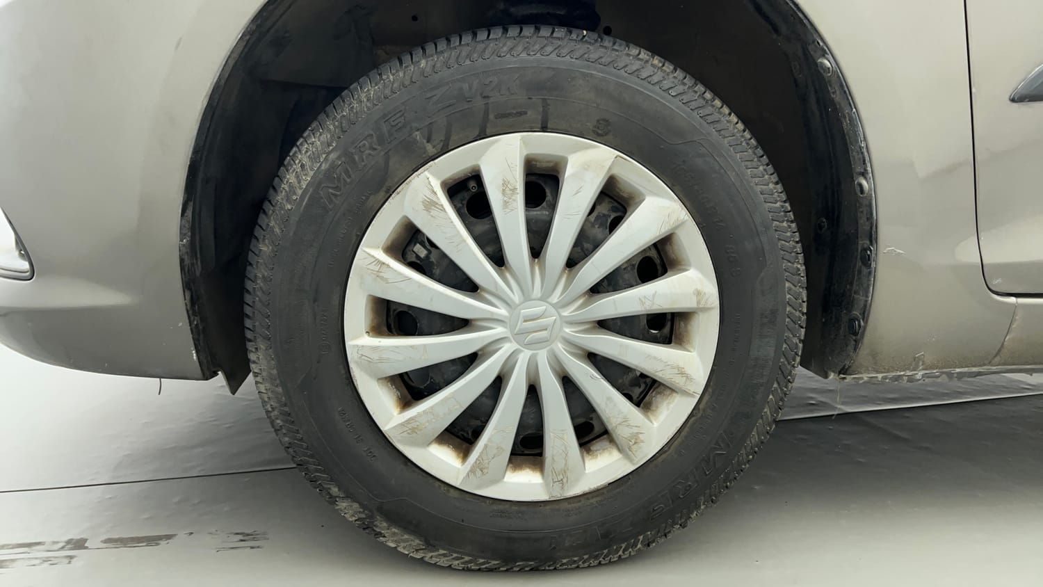 Used 2015 Maruti Suzuki Swift Dzire VXI Petrol Manual tyres LEFT FRONT TYRE RIM VIEW