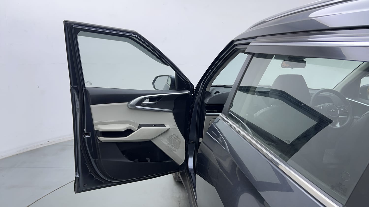 Used 2022 Kia Carens Prestige Plus 1.4 Petrol MT 7 STR Petrol Manual interior LEFT FRONT DOOR OPEN VIEW