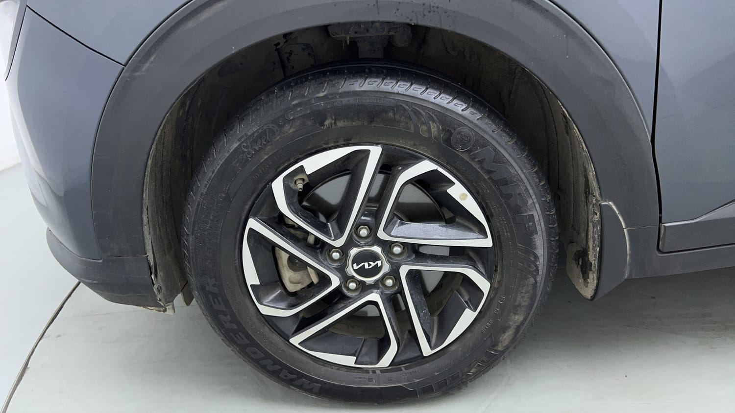 Used 2022 Kia Carens Prestige Plus 1.4 Petrol MT 7 STR Petrol Manual tyres LEFT FRONT TYRE RIM VIEW