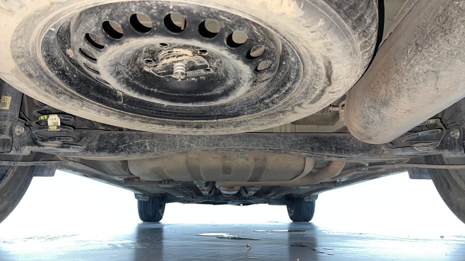 Used 2022 Kia Carens Prestige Plus 1.4 Petrol MT 7 STR Petrol Manual extra REAR UNDERBODY VIEW (TAKEN FROM REAR)