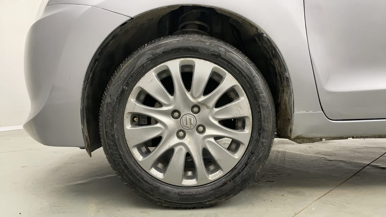 Used 2018 Maruti Suzuki Baleno Zeta 1.2 Petrol Manual tyres LEFT FRONT TYRE RIM VIEW