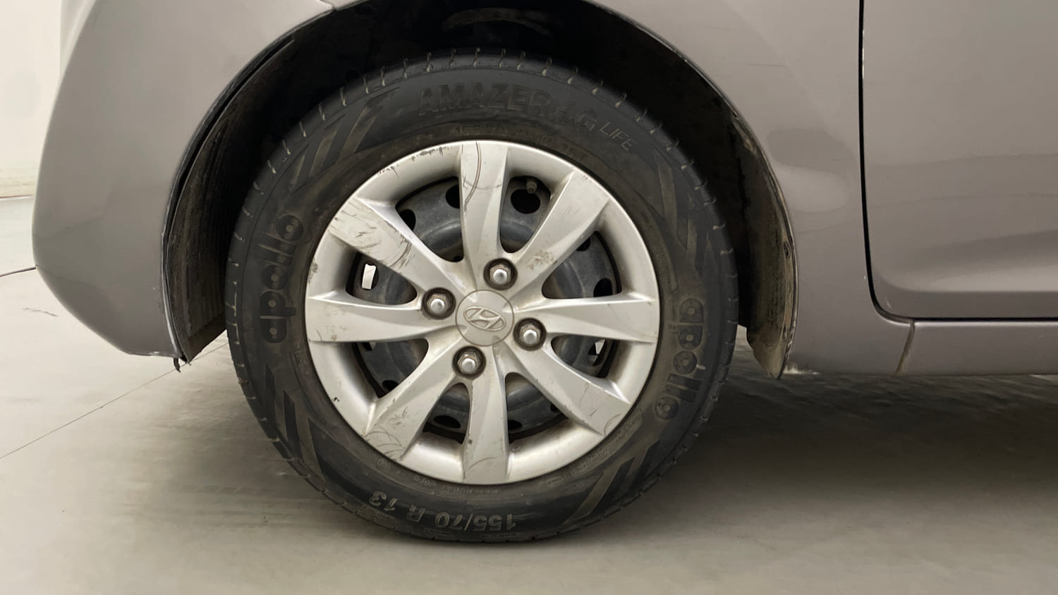 Used 2013 Hyundai Eon Magna Petrol Manual tyres LEFT FRONT TYRE RIM VIEW