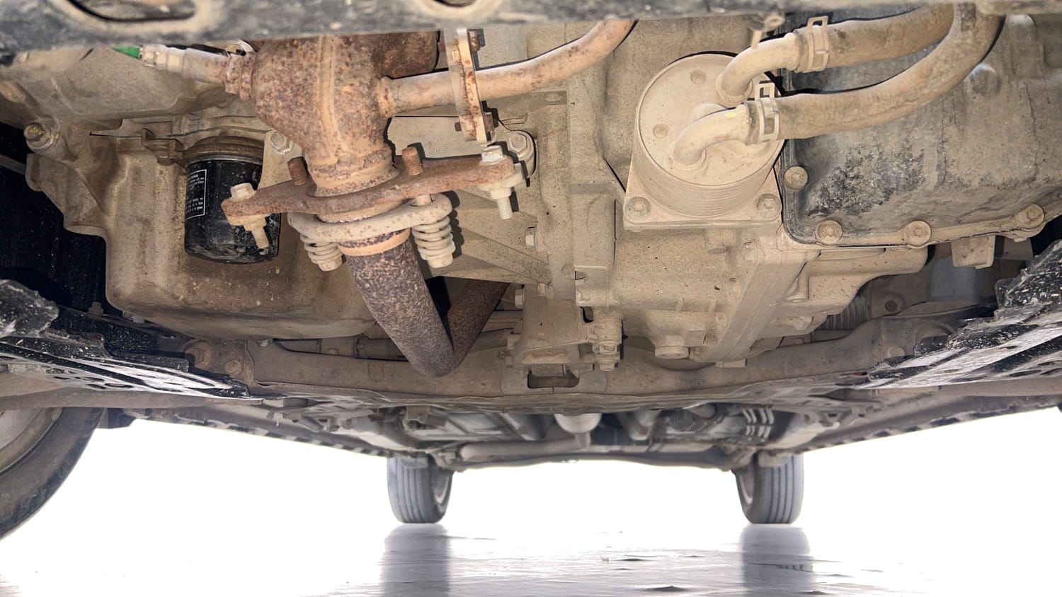 Used 2022 Maruti Suzuki XL6 Alpha Plus AT Petrol Petrol Automatic extra FRONT LEFT UNDERBODY VIEW