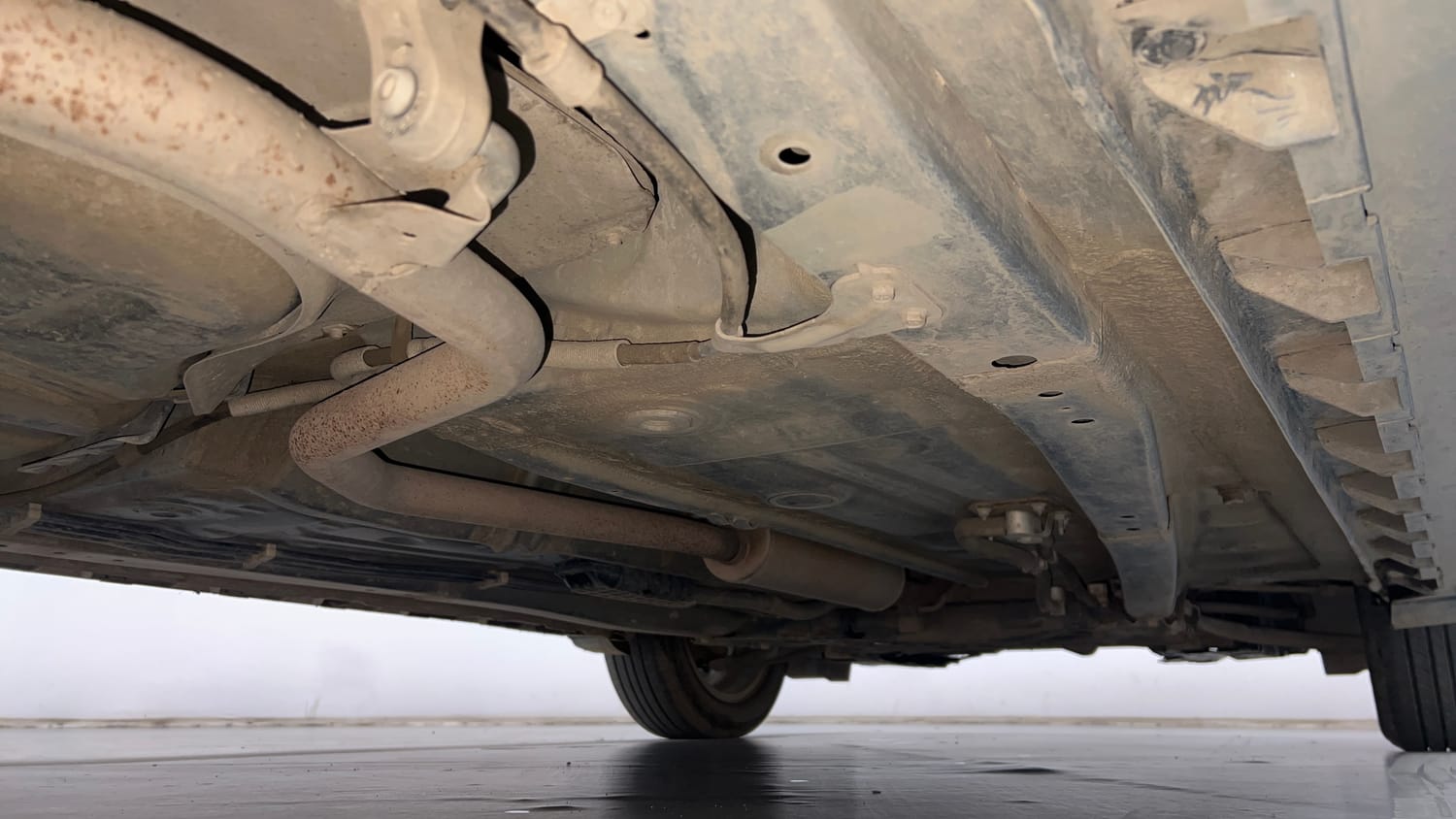 Used 2022 Maruti Suzuki XL6 Alpha Plus AT Petrol Petrol Automatic extra REAR RIGHT UNDERBODY VIEW