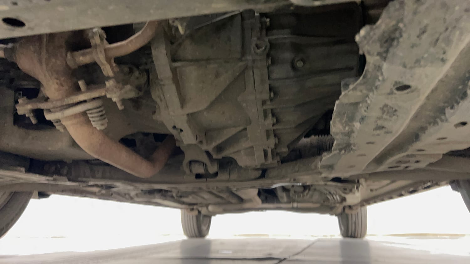 Used 2023 Maruti Suzuki XL6 Alpha MT Petrol Petrol Manual extra FRONT LEFT UNDERBODY VIEW