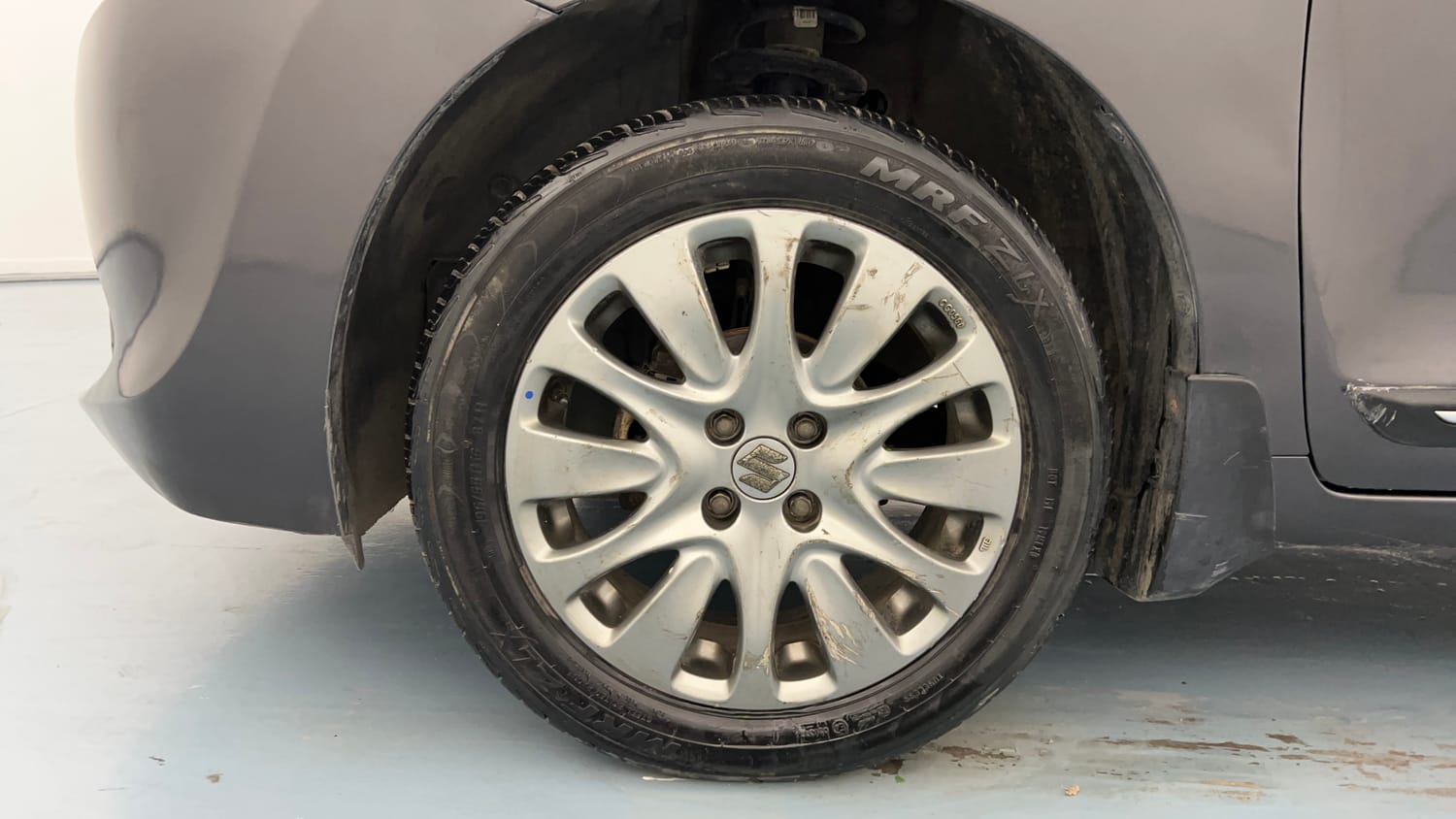 Used 2016 Maruti Suzuki Baleno Zeta 1.2 Petrol Manual tyres LEFT FRONT TYRE RIM VIEW