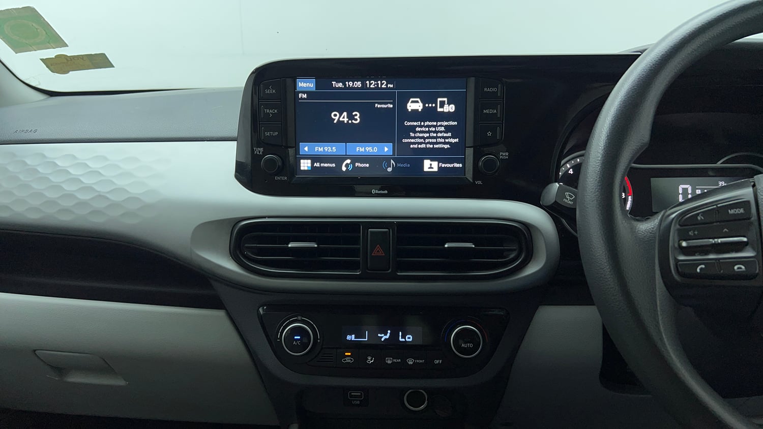Used 2021 Hyundai Grand i10 Nios Sportz 1.2 Kappa VTVT Petrol Manual top_features Integrated (in-dash) music system