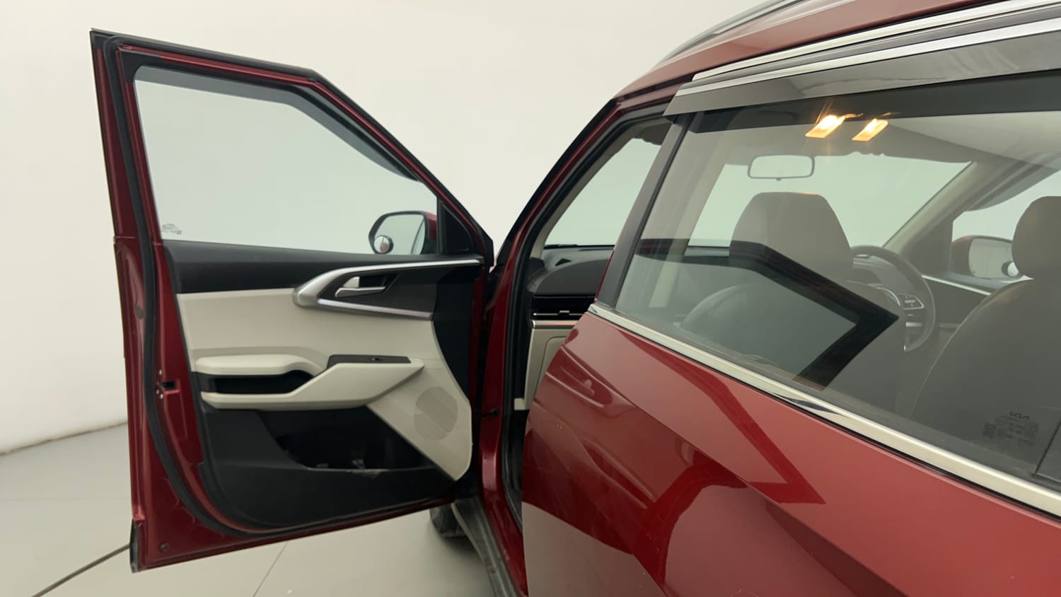 Used 2023 Kia Carens Prestige Plus 1.4 Petrol MT 7 STR Petrol Manual interior LEFT FRONT DOOR OPEN VIEW