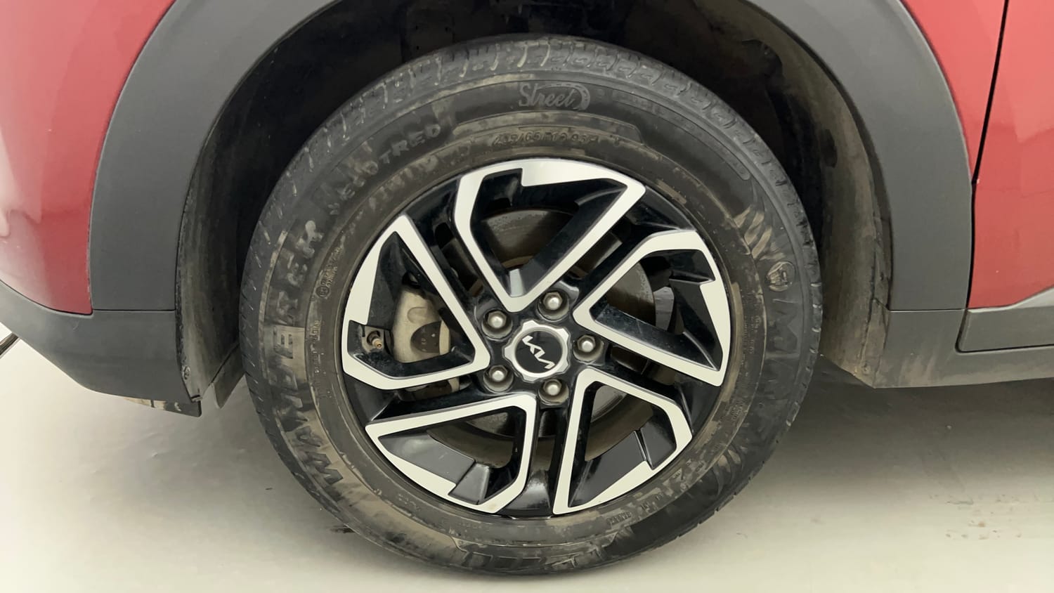 Used 2023 Kia Carens Prestige Plus 1.4 Petrol MT 7 STR Petrol Manual tyres LEFT FRONT TYRE RIM VIEW