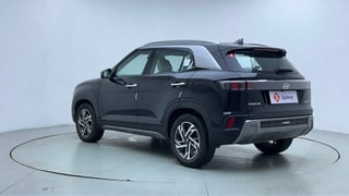 Used 2024 Hyundai Creta 1.5 Turbo Petrol DCT SX(O) Petrol Automatic exterior LEFT REAR CORNER VIEW