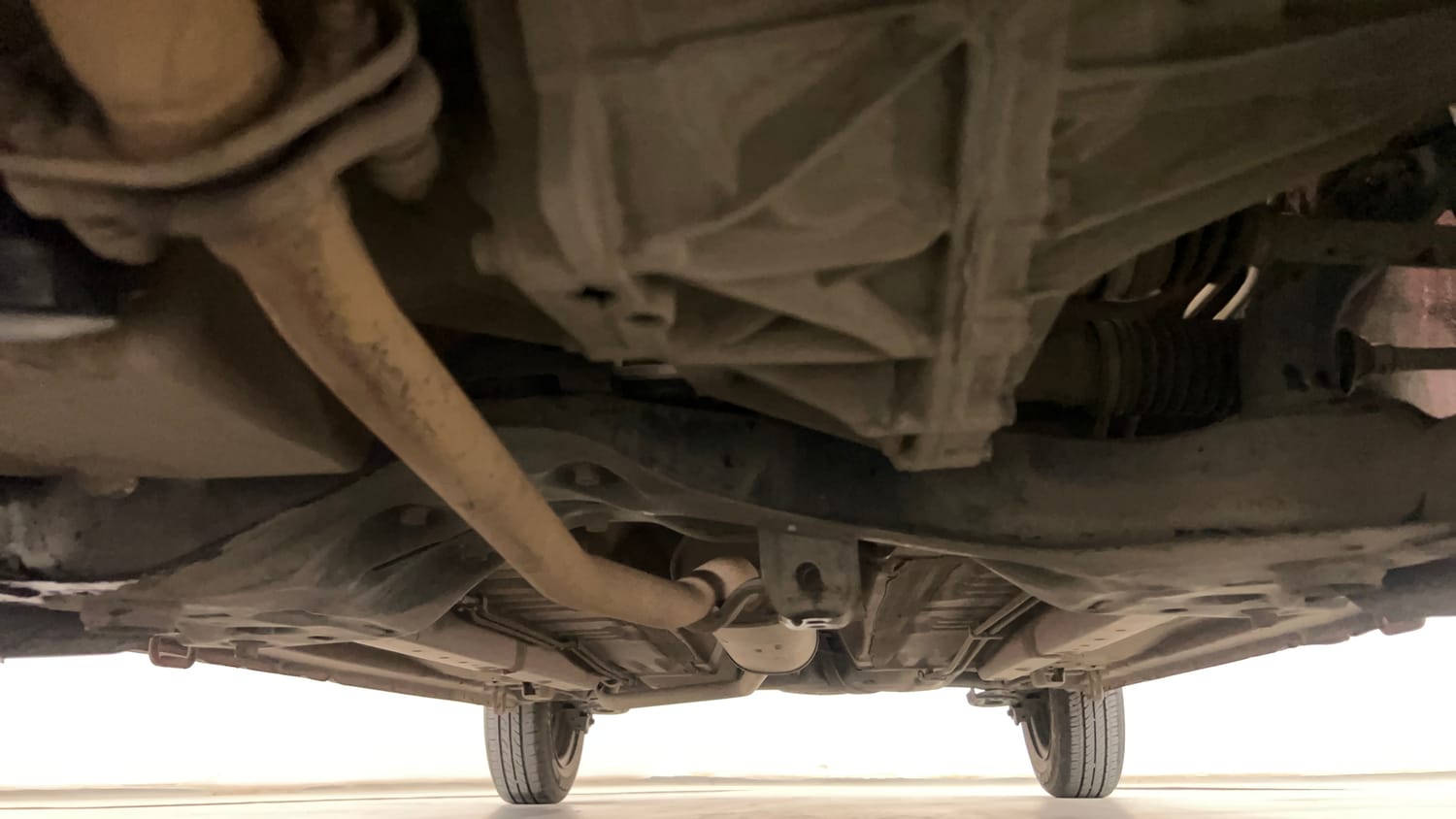 Used 2014 Maruti Suzuki Celerio VXi AMT Petrol Automatic extra FRONT LEFT UNDERBODY VIEW