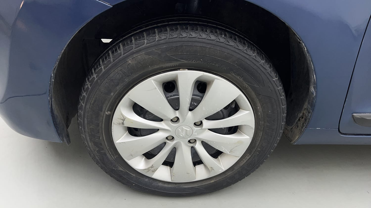 Used 2016 Maruti Suzuki Baleno Delta 1.2 Petrol Manual tyres LEFT FRONT TYRE RIM VIEW