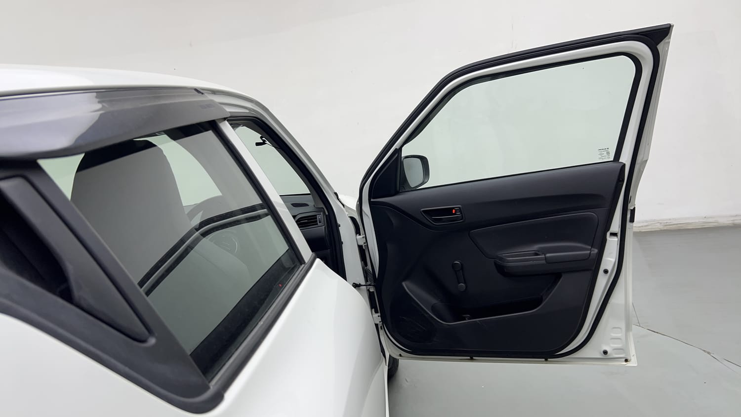 Used 2023 Maruti Suzuki Swift LXi Petrol Manual interior RIGHT FRONT DOOR OPEN VIEW