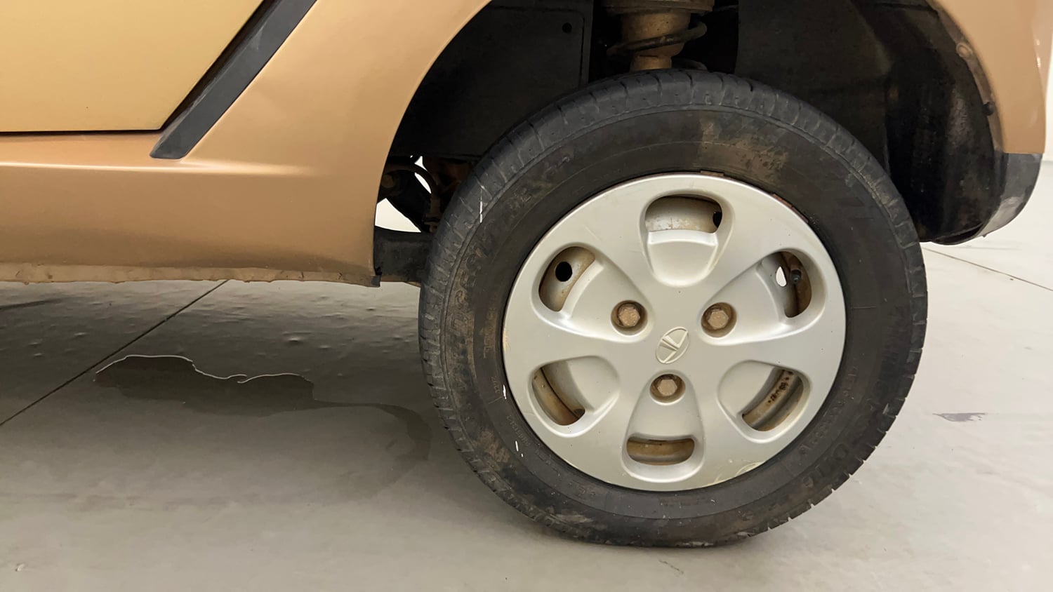 Used 2014 Tata Nano Twist XT Petrol Manual tyres LEFT REAR TYRE RIM VIEW