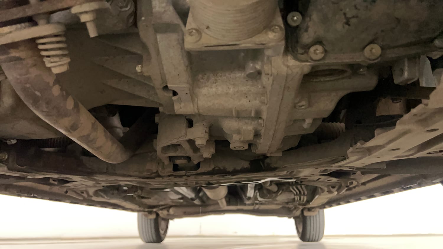 Used 2025 Maruti Suzuki XL6 Alpha Plus AT Petrol Petrol Automatic extra FRONT LEFT UNDERBODY VIEW