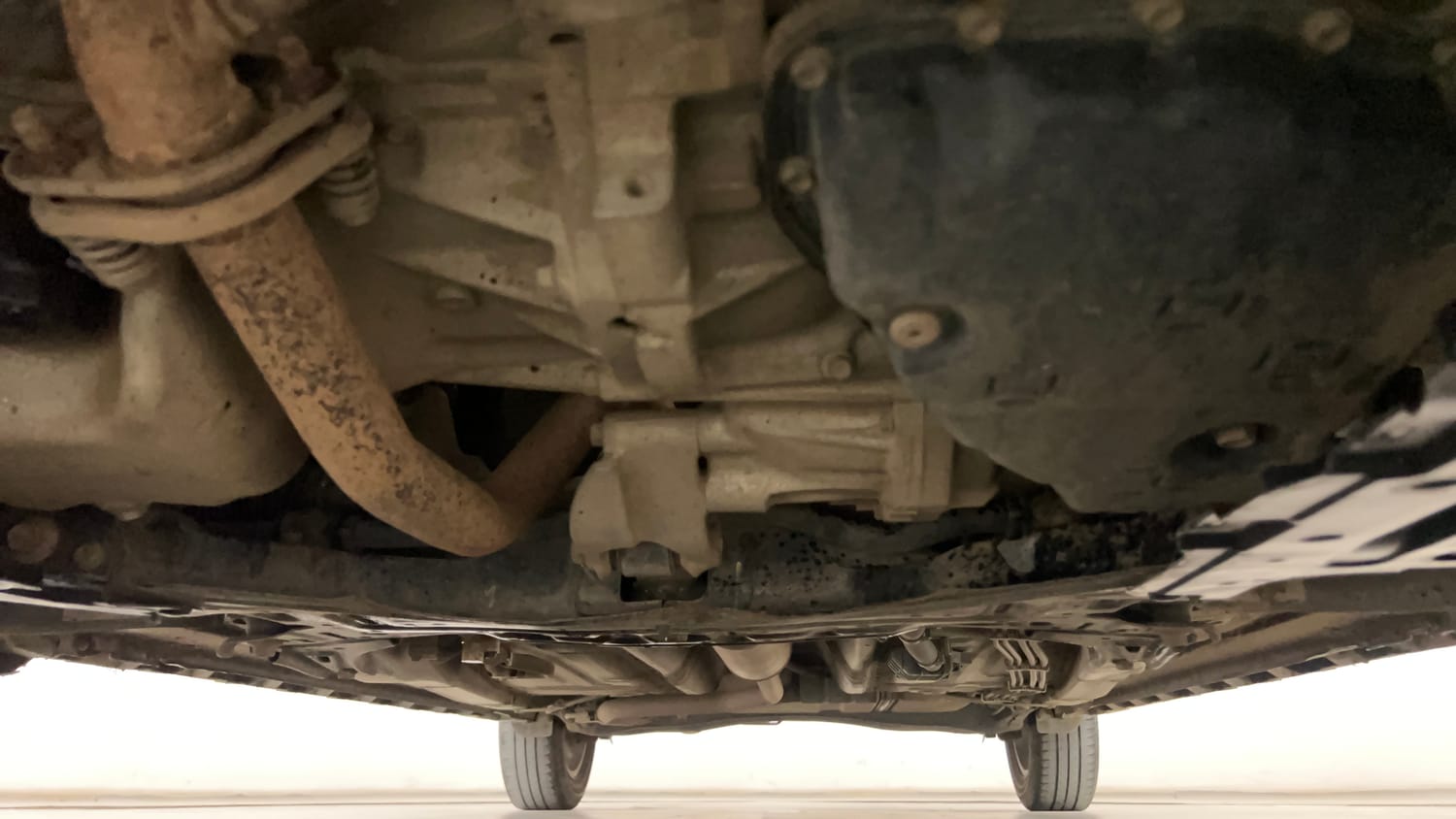 Used 2019 Maruti Suzuki XL6 Alpha AT Petrol Petrol Automatic extra FRONT LEFT UNDERBODY VIEW