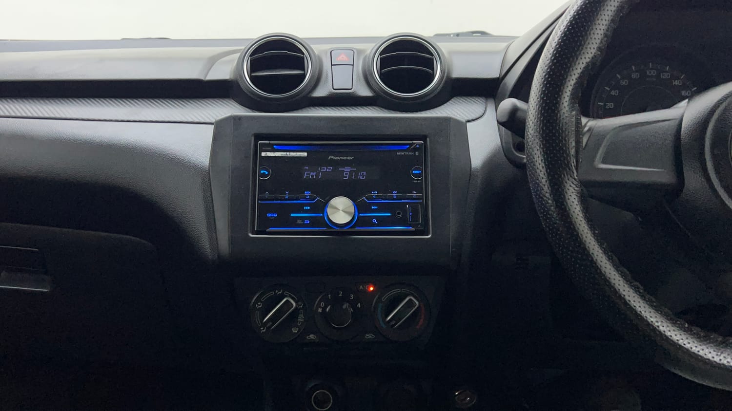 Used 2019 Maruti Suzuki Swift LXi Petrol Manual interior MUSIC SYSTEM & AC CONTROL VIEW