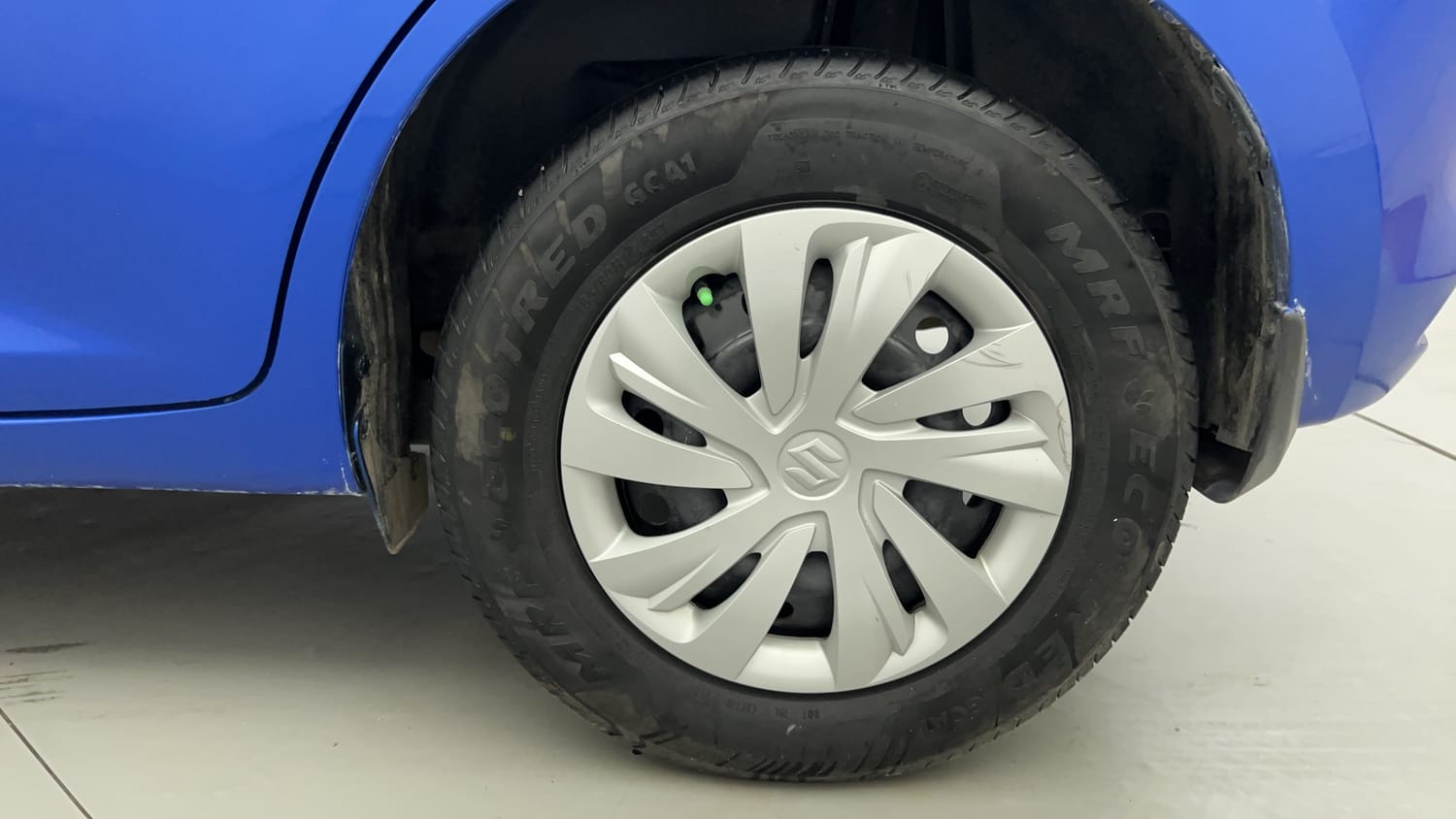 Used 2024 Maruti Suzuki Swift VXi (O) Petrol Manual tyres LEFT REAR TYRE RIM VIEW