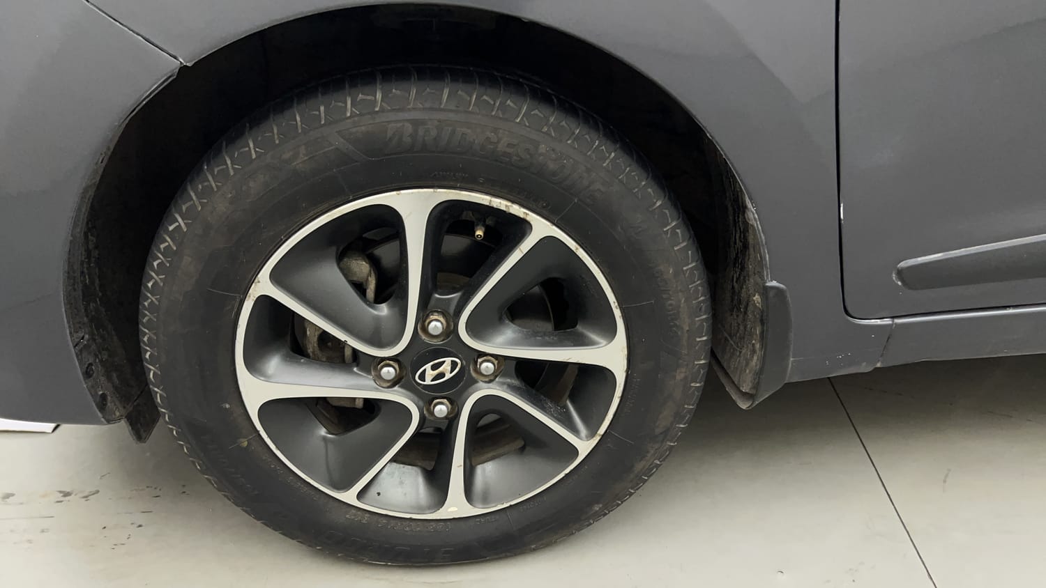 Used 2017 Hyundai Grand i10 Asta 1.2 Kappa VTVT Petrol Manual tyres LEFT FRONT TYRE RIM VIEW