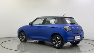 Used 2025 Maruti Suzuki Swift ZXi Plus Dual Tone Petrol Manual exterior LEFT REAR CORNER VIEW