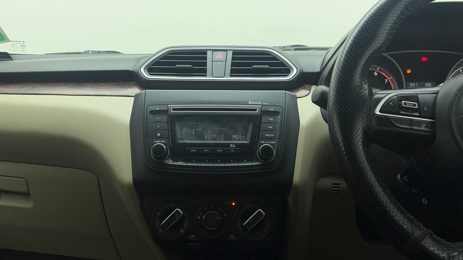 Used 2018 Maruti Suzuki Dzire VXi AMT Petrol Automatic top_features Integrated (in-dash) music system