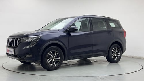 Used 2024 Mahindra XUV700 AX5 Petrol MT 7 STR Petrol Manual exterior LEFT FRONT CORNER VIEW