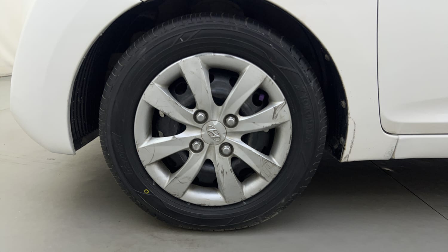 Used 2012 Hyundai Eon Magna Petrol Manual tyres LEFT FRONT TYRE RIM VIEW