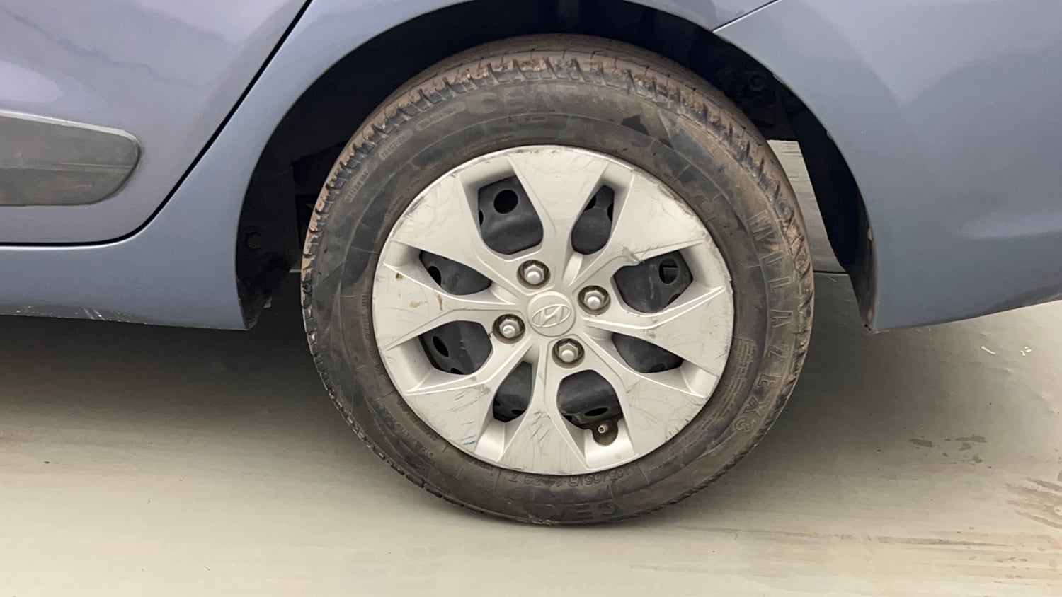 Used 2014 Hyundai Xcent S 1.2 Petrol Manual tyres LEFT REAR TYRE RIM VIEW