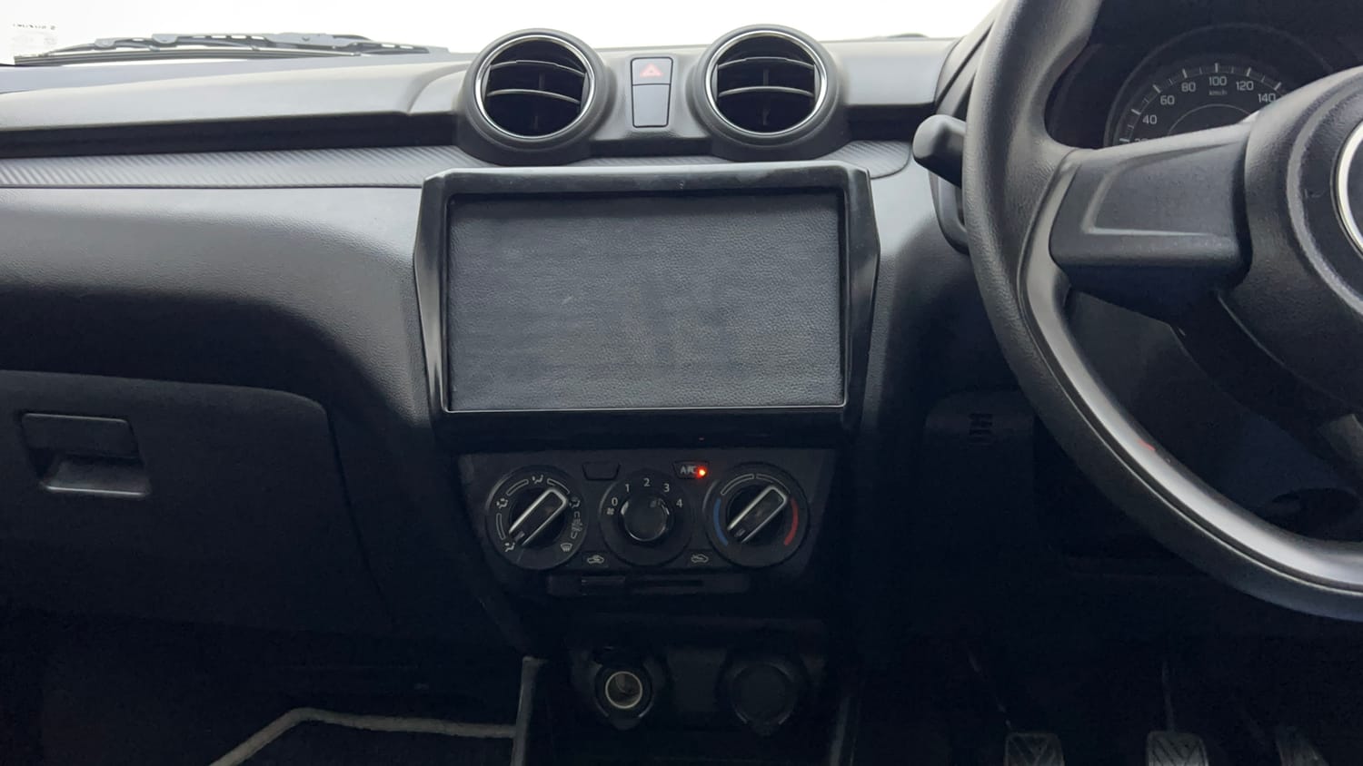 Used 2023 Maruti Suzuki Swift LXi Petrol Manual interior MUSIC SYSTEM & AC CONTROL VIEW