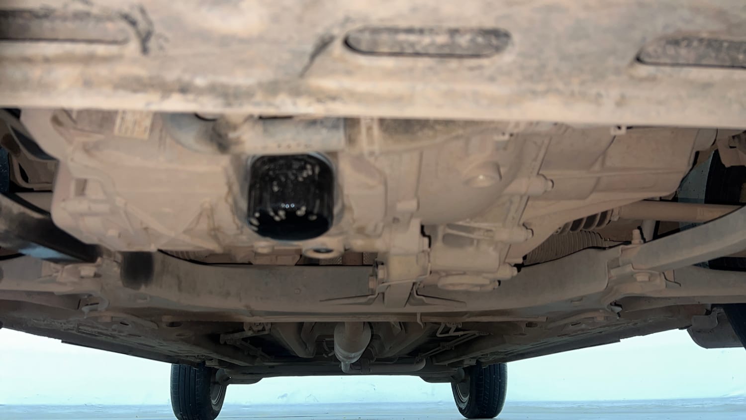 Used 2024 Nissan Magnite Tekna Plus B4D 1.0 Petrol AMT Dual Tone Petrol Automatic extra FRONT LEFT UNDERBODY VIEW