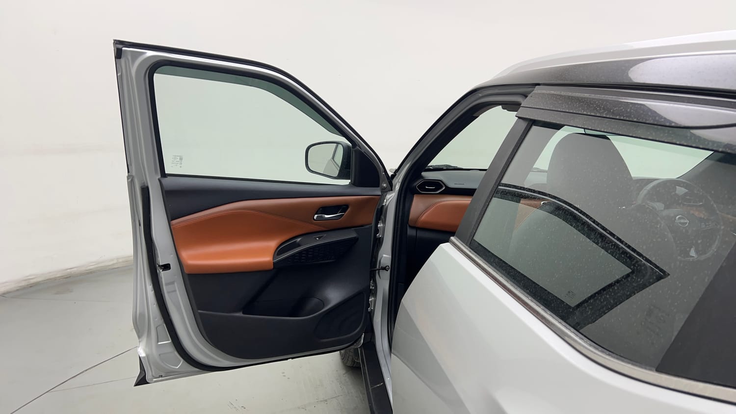 Used 2024 Nissan Magnite Tekna Plus B4D 1.0 Petrol AMT Dual Tone Petrol Automatic interior LEFT FRONT DOOR OPEN VIEW