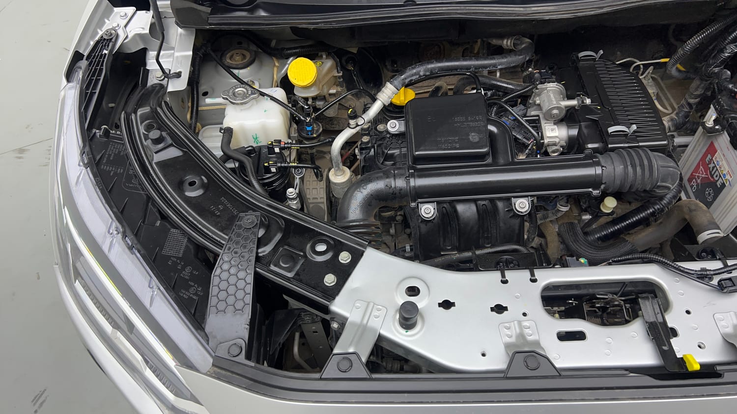 Used 2024 Nissan Magnite Tekna Plus B4D 1.0 Petrol AMT Dual Tone Petrol Automatic engine ENGINE RIGHT SIDE VIEW