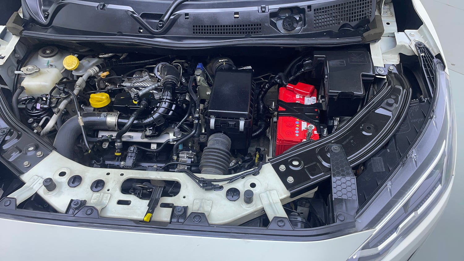 Used 2022 Nissan Magnite XV Premium Turbo CVT Dual Tone Petrol Automatic engine ENGINE LEFT SIDE VIEW
