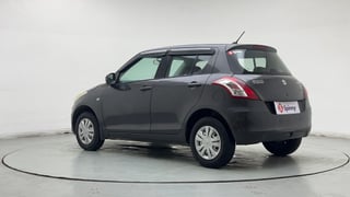 Used 2017 Maruti Suzuki Swift Lxi (O) Petrol Manual exterior LEFT REAR CORNER VIEW