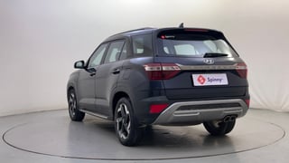 Used 2023 Hyundai Alcazar Platinum (O) 7 Seater 1.5 Diesel AT Diesel Automatic exterior LEFT REAR CORNER VIEW