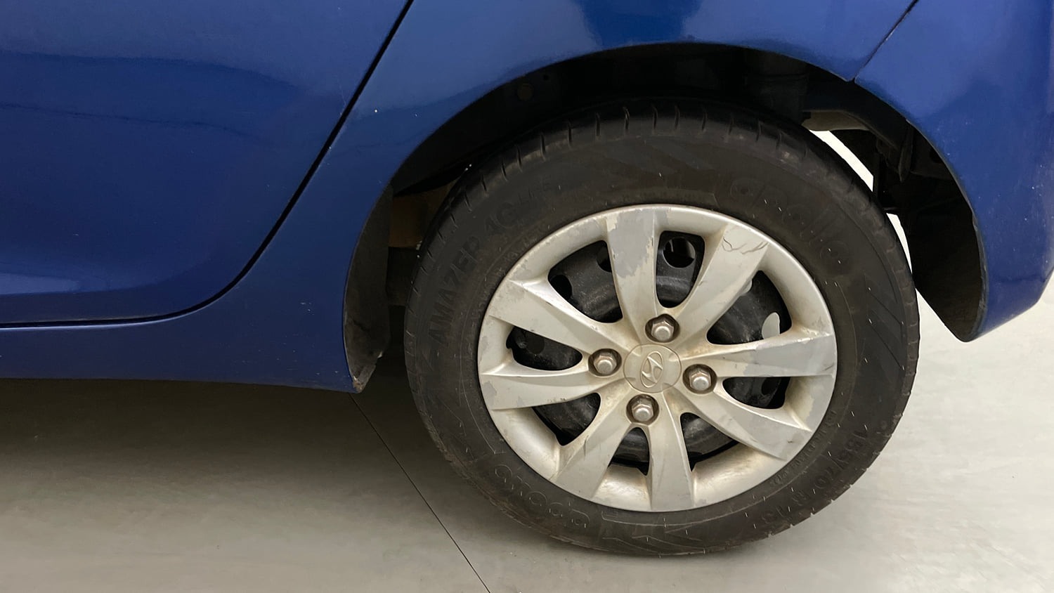 Used 2012 Hyundai Eon Sportz Petrol Manual tyres LEFT REAR TYRE RIM VIEW