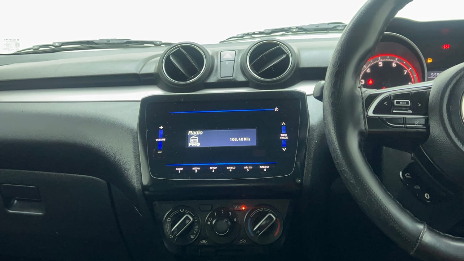 Used 2022 Maruti Suzuki Swift VXi Petrol Manual top_features Integrated (in-dash) music system