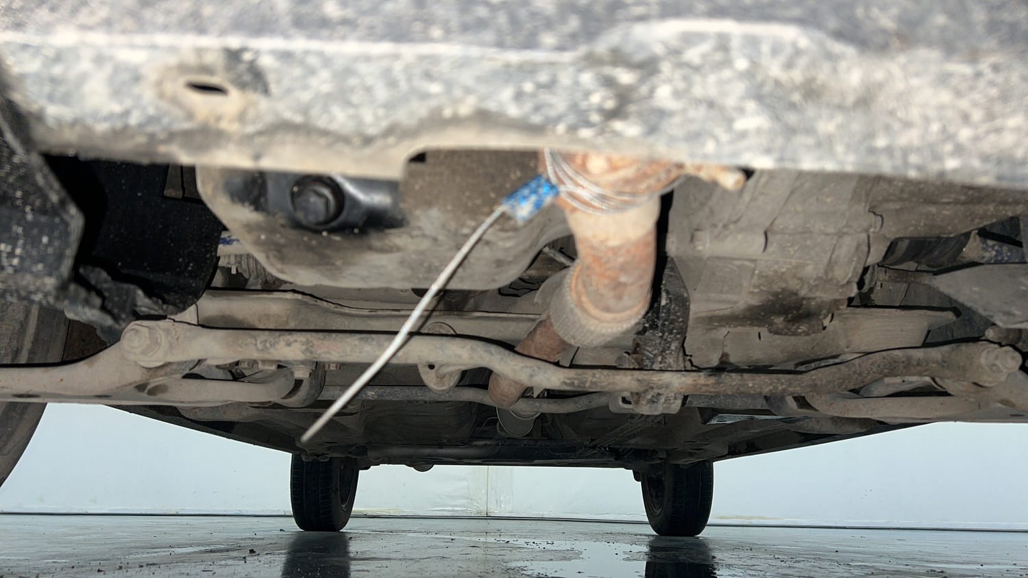 Used 2019 Tata Tigor Revotron XZ+ Petrol Manual extra FRONT LEFT UNDERBODY VIEW