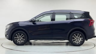 Used 2025 Mahindra XUV700 AX7 Petrol MT 7 STR Petrol Manual exterior LEFT SIDE VIEW