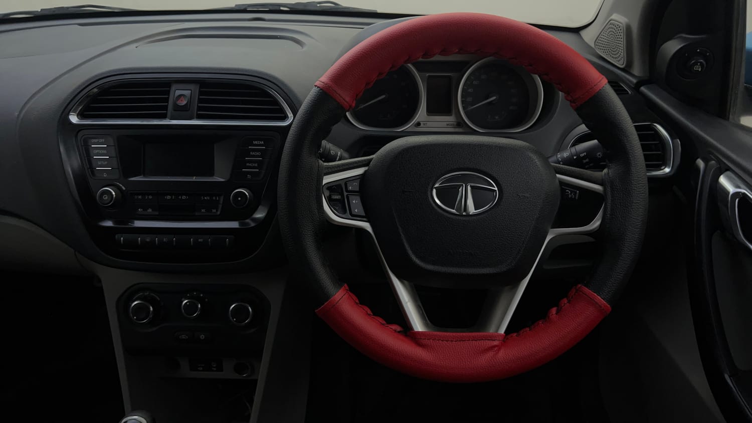 Used 2017 Tata Tiago Revotron XZ Petrol Manual top_features Steering mounted controls