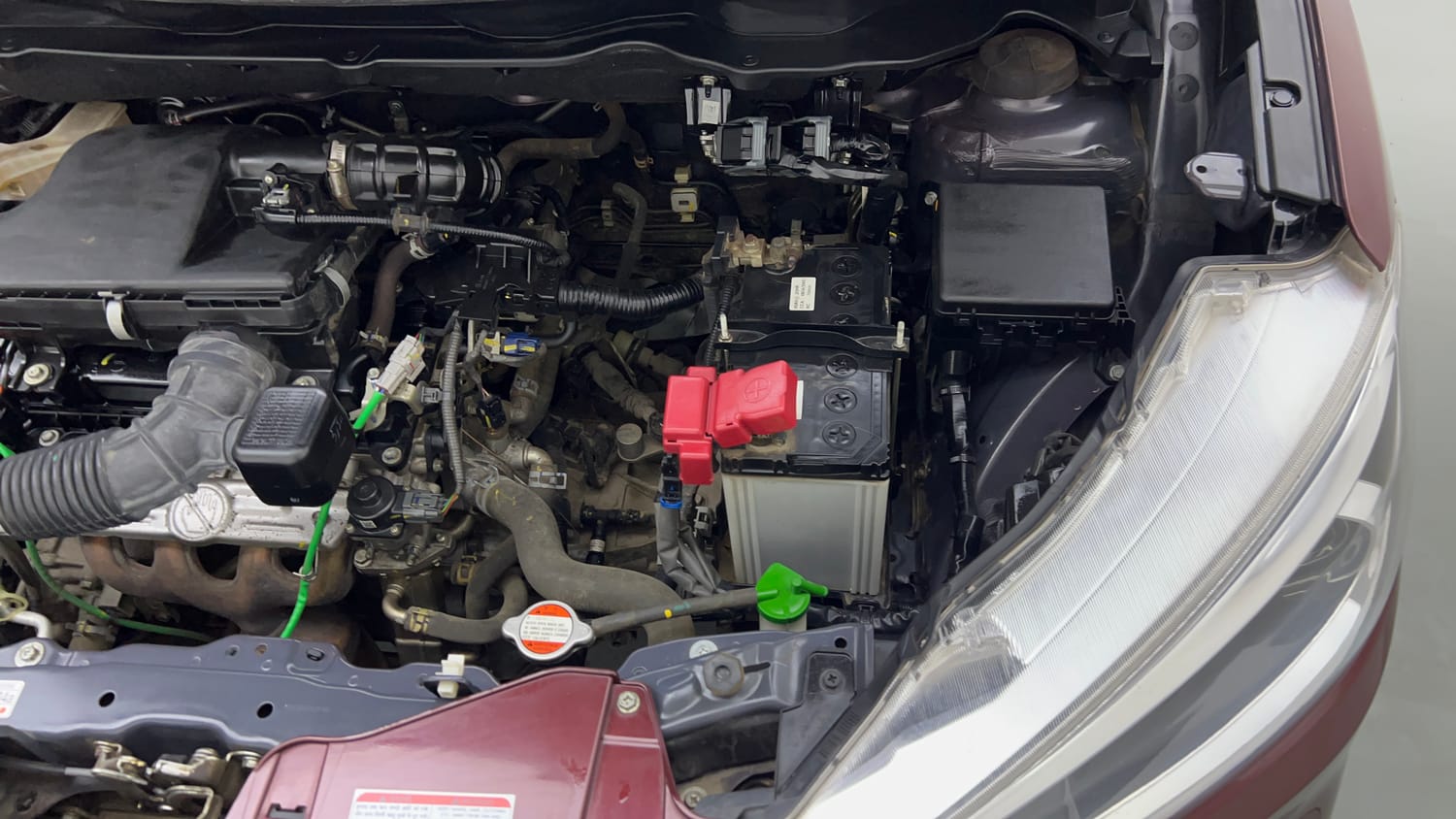 Used 2023 Maruti Suzuki Ertiga VXi (O) Petrol Manual engine ENGINE LEFT SIDE VIEW