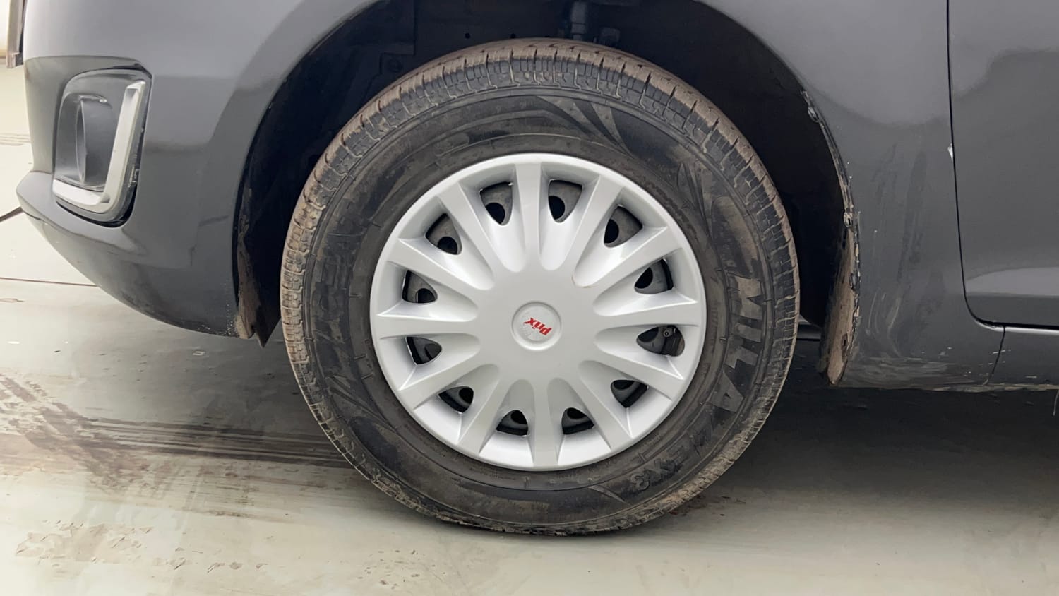 Used 2015 Maruti Suzuki Swift VXi Petrol Manual tyres LEFT FRONT TYRE RIM VIEW