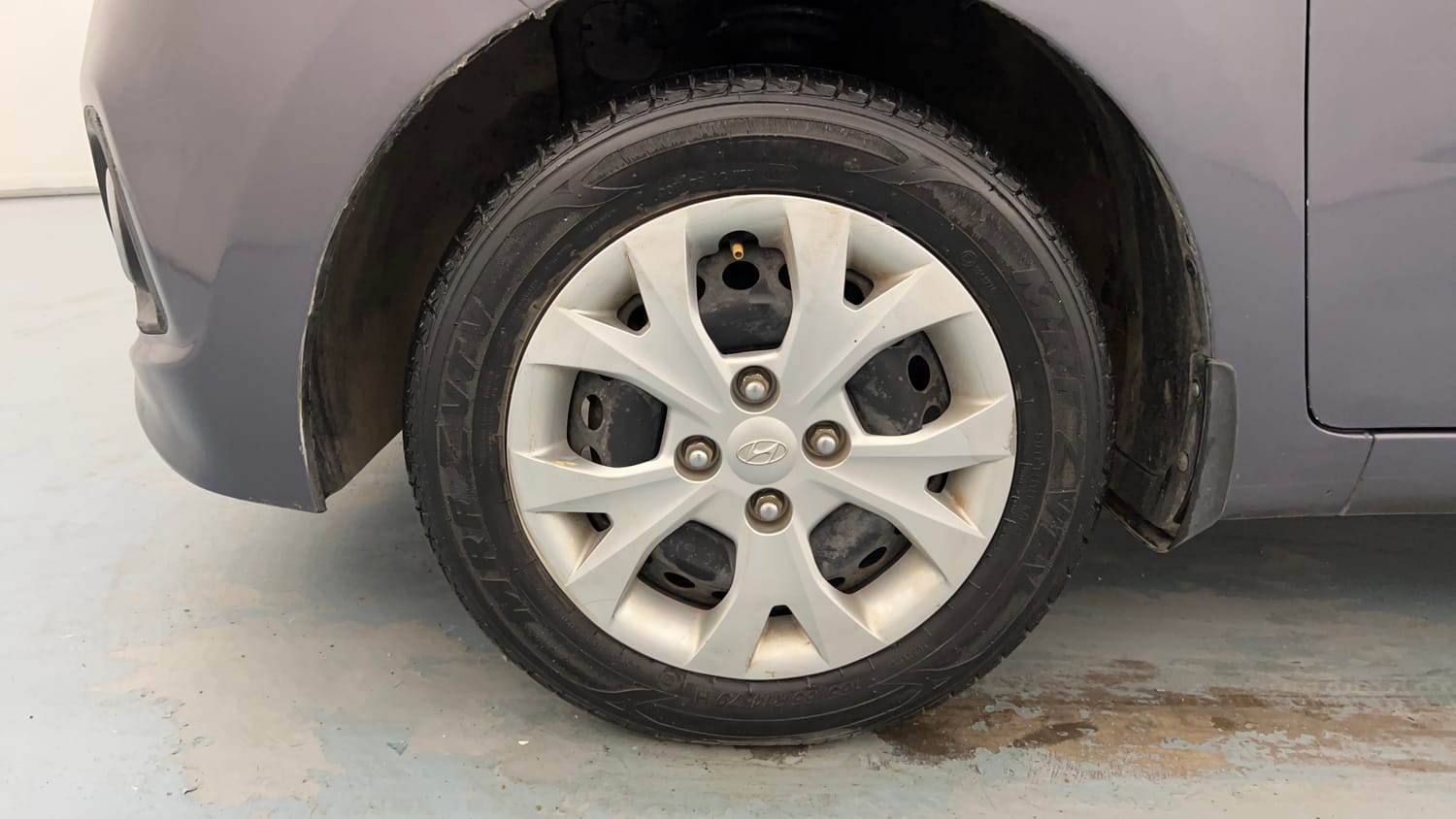 Used 2014 Hyundai Grand i10 Magna 1.2 Kappa VTVT Petrol Manual tyres LEFT FRONT TYRE RIM VIEW