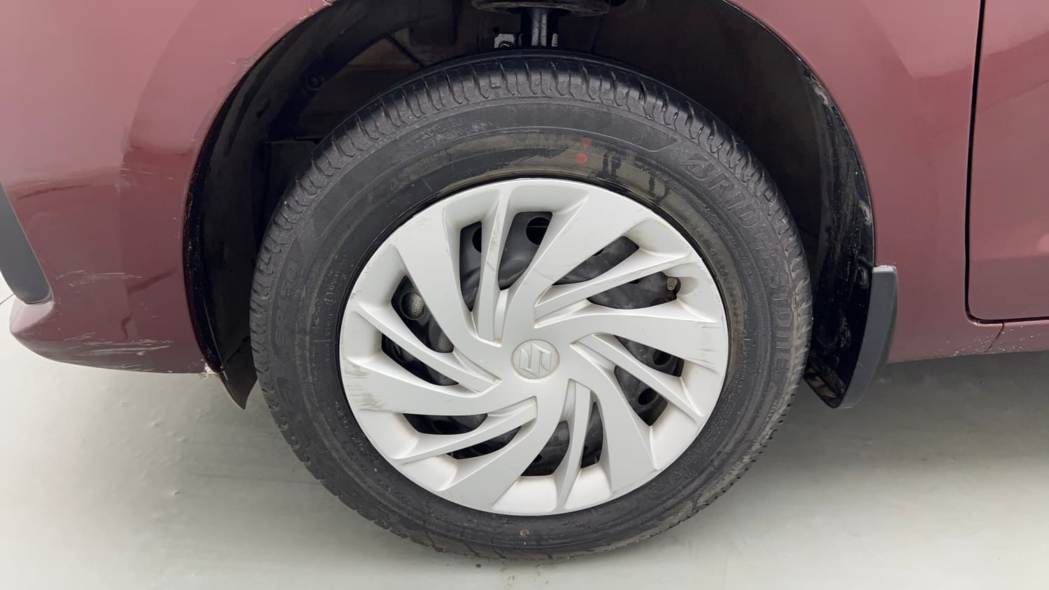 Used 2023 Maruti Suzuki Ertiga VXi (O) Petrol Manual tyres LEFT FRONT TYRE RIM VIEW